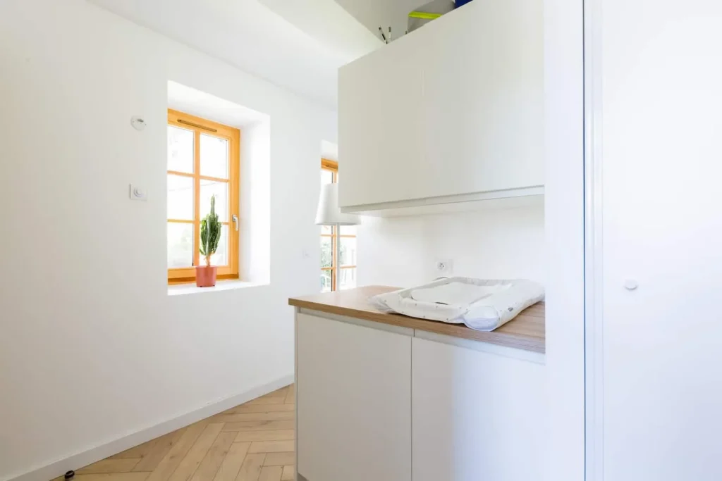 Laundry room with baby changing area – Le Jardin de Talloires
