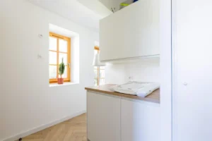 Laundry room with baby changing area – Le Jardin de Talloires