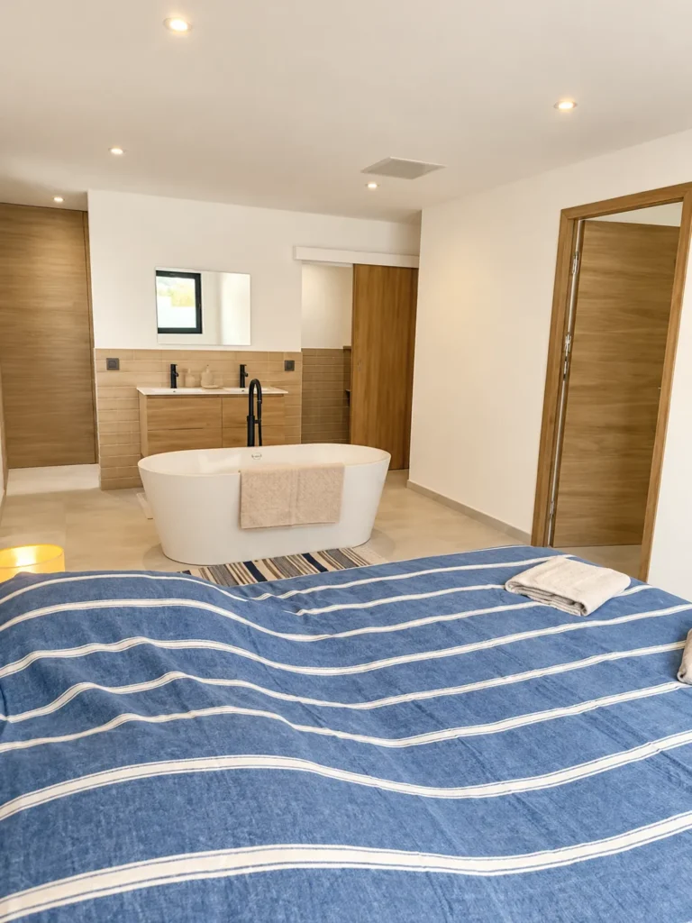 View from the bedroom towards the freestanding bathtub and bathing area – L’Annexe du Domaine de la Subérine